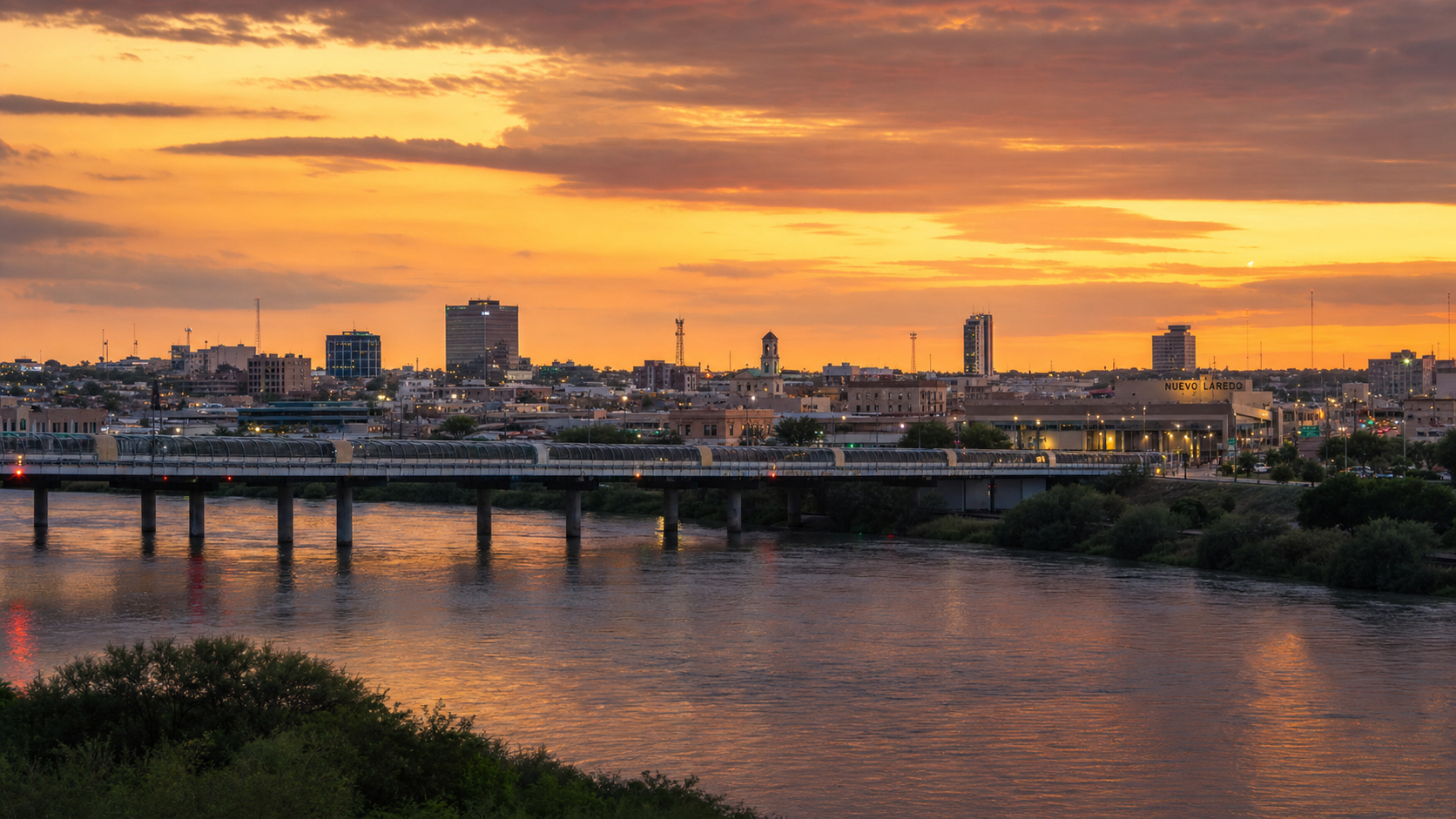 Laredo Texas Rio Grande skyline at dusk with international bridge to Mexico