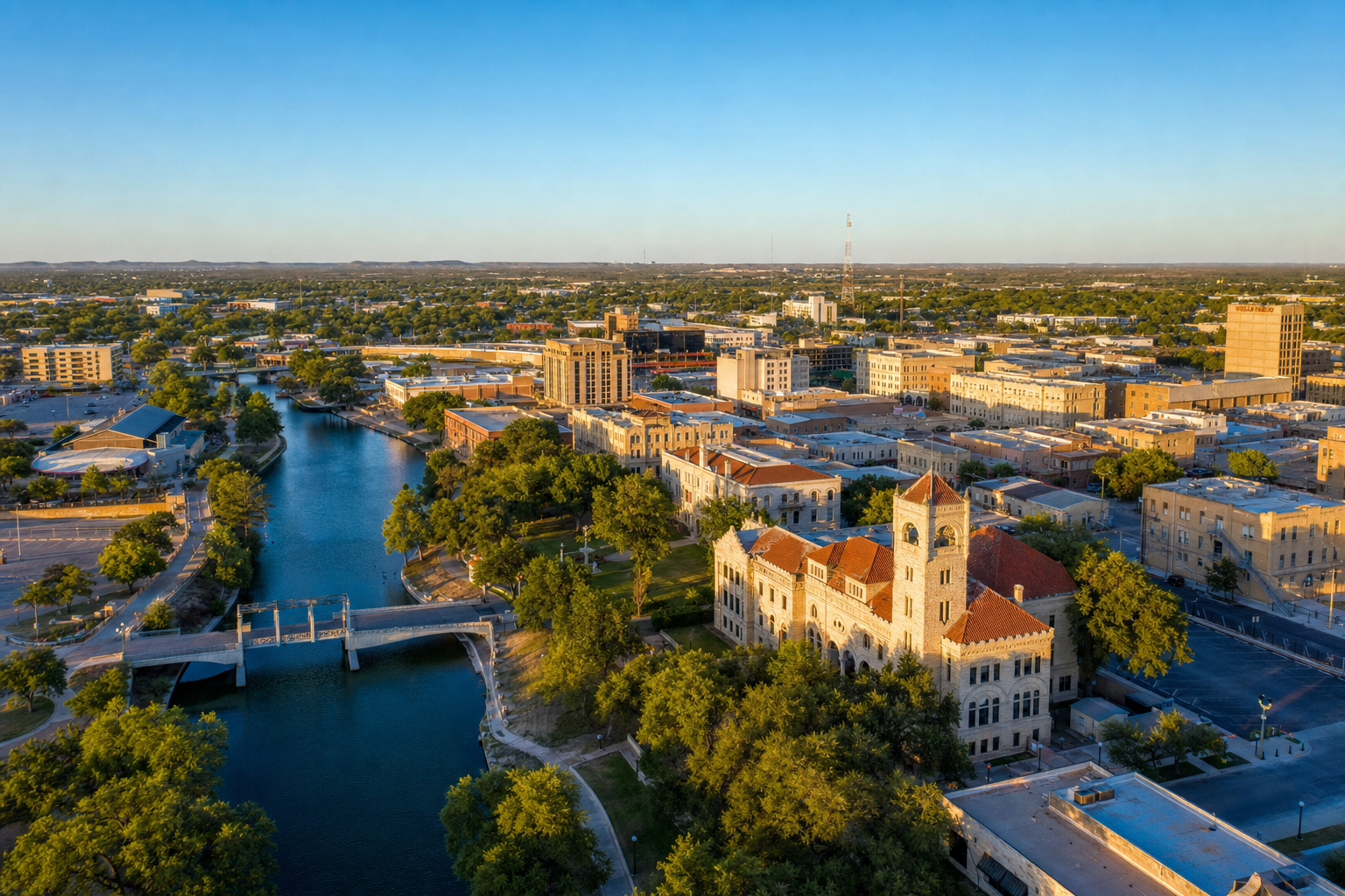 San Angelo Texas skyline along the Concho River with historic limestone architecture