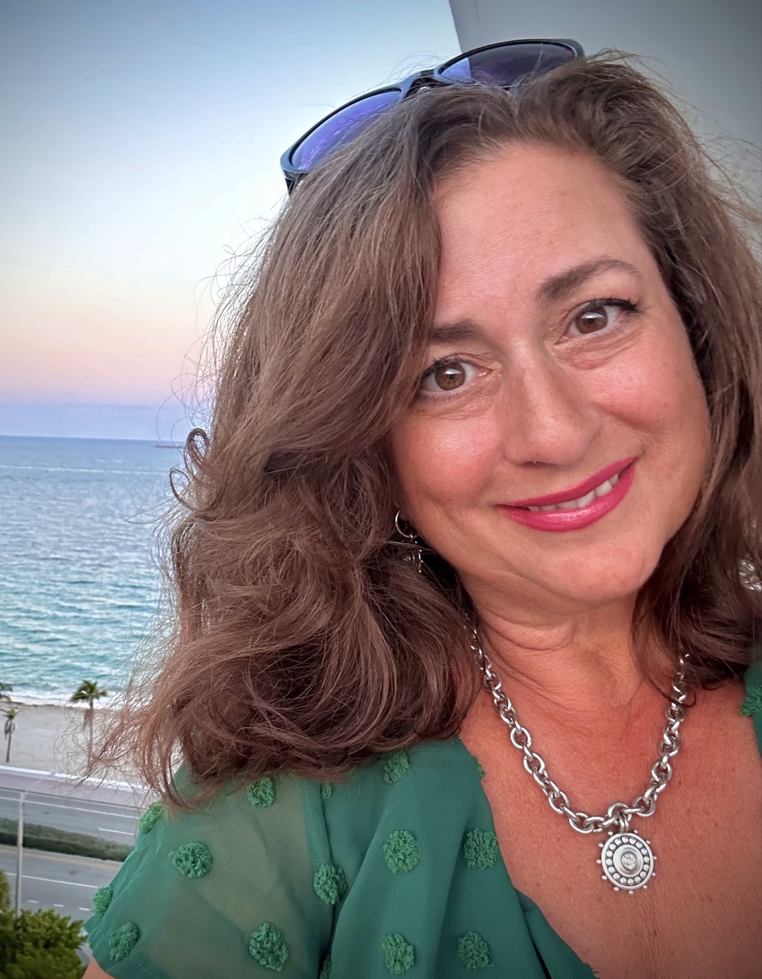 Dawn Bearden, Founder of Moxxie Asset Group, photographed with the ocean in the background