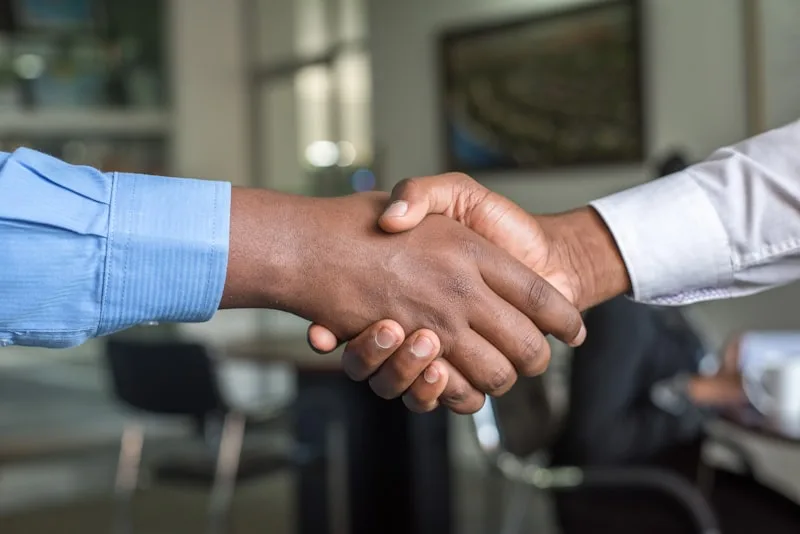Professional handshake representing trust and honest business