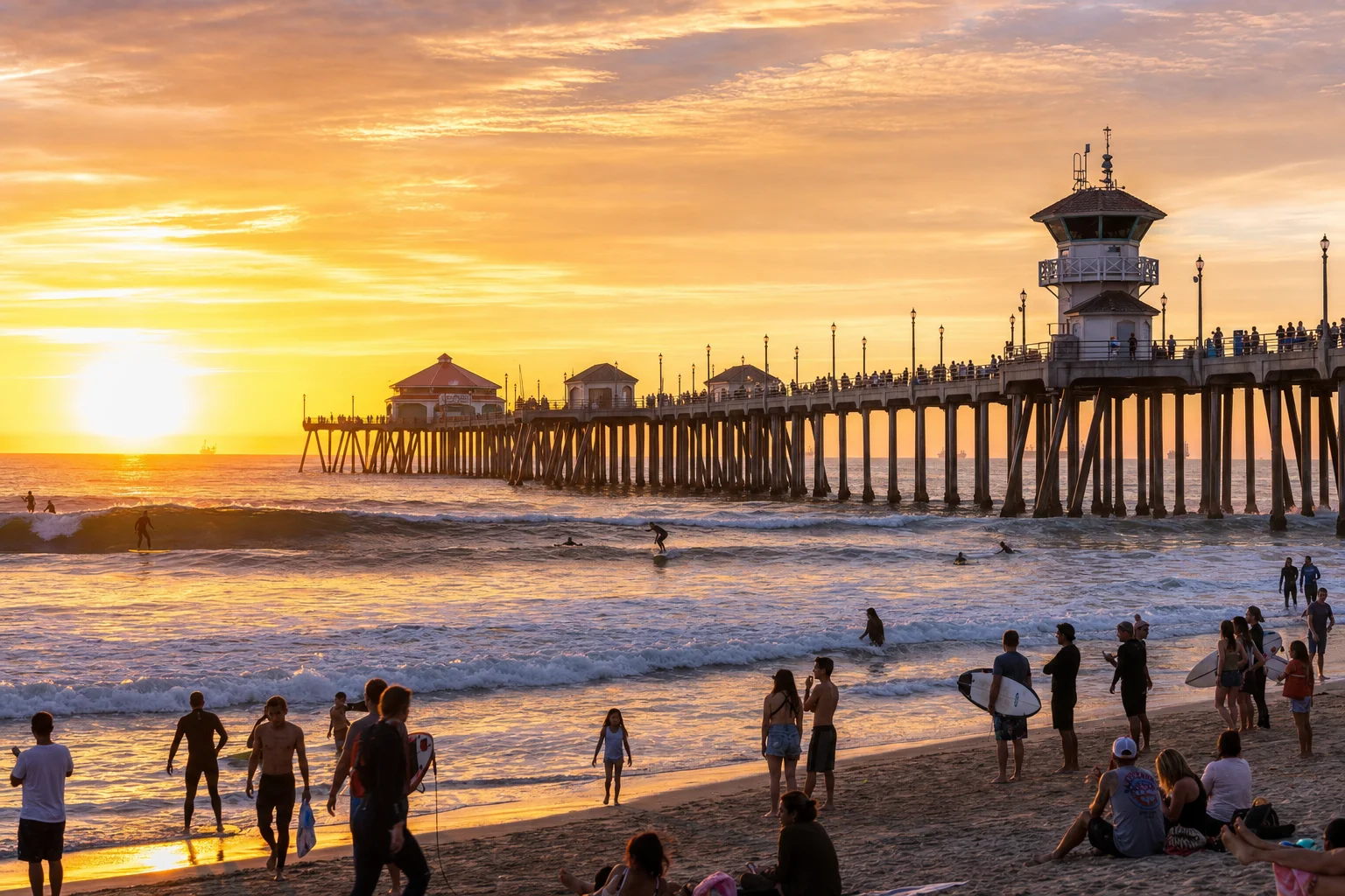 Huntington Beach Surf City pier at golden hour with surfers riding waves — Orange County California