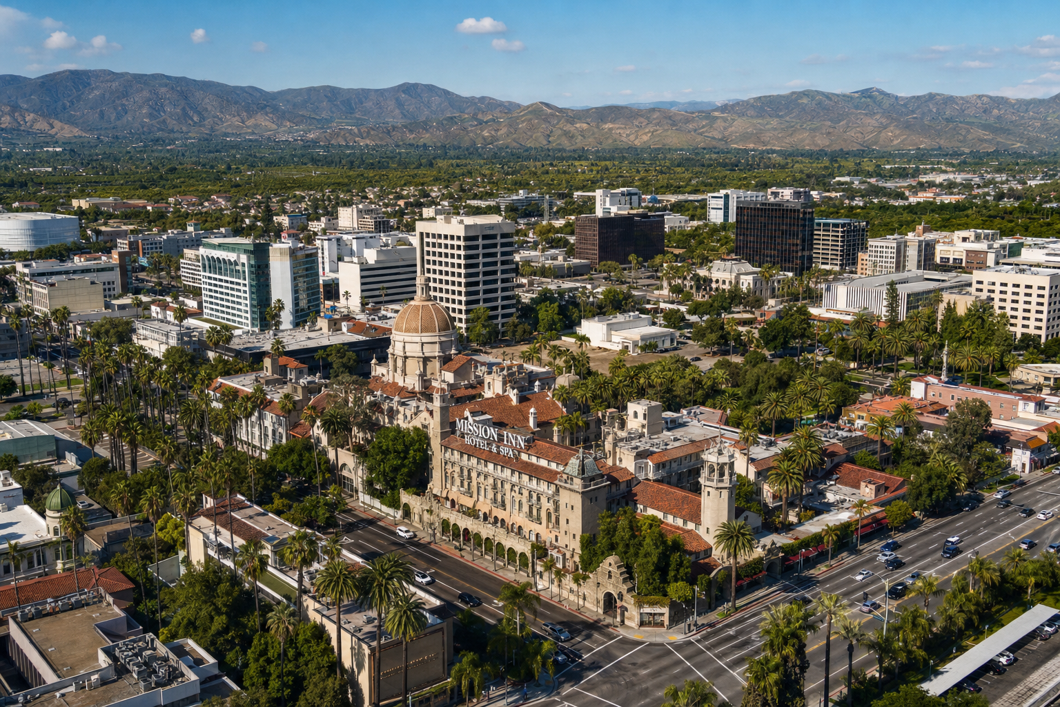 Aerial view of downtown Riverside California with Mission Inn Hotel landmark building and citrus groves