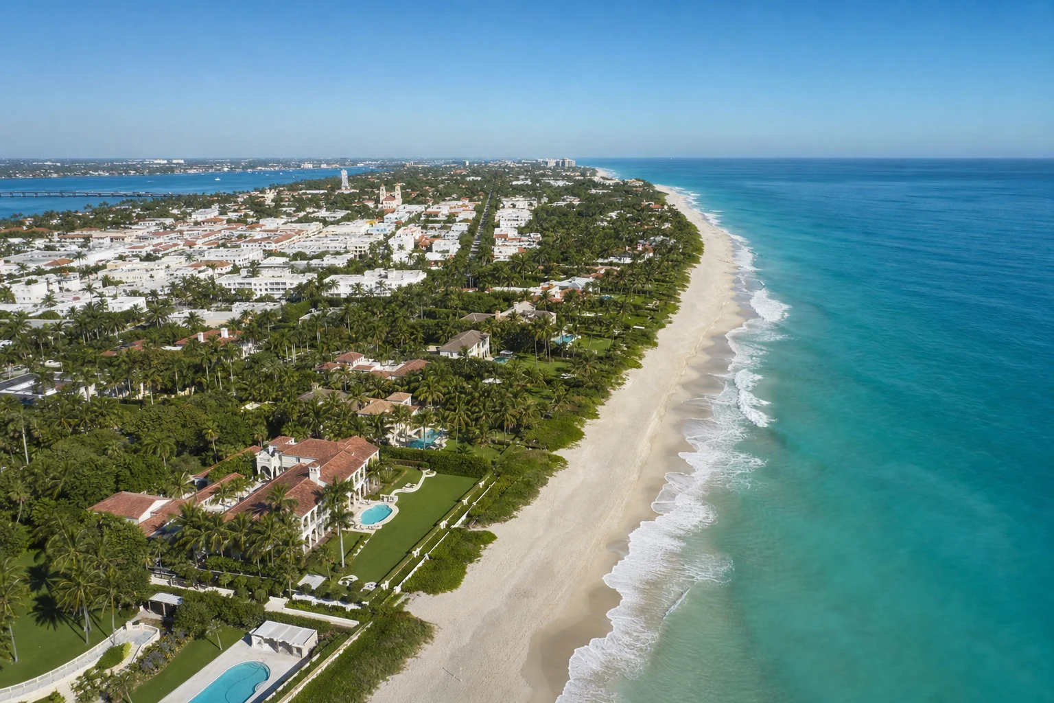 Aerial view of Palm Beach Island Florida with luxury oceanfront estates, turquoise Atlantic Ocean and white sand beach